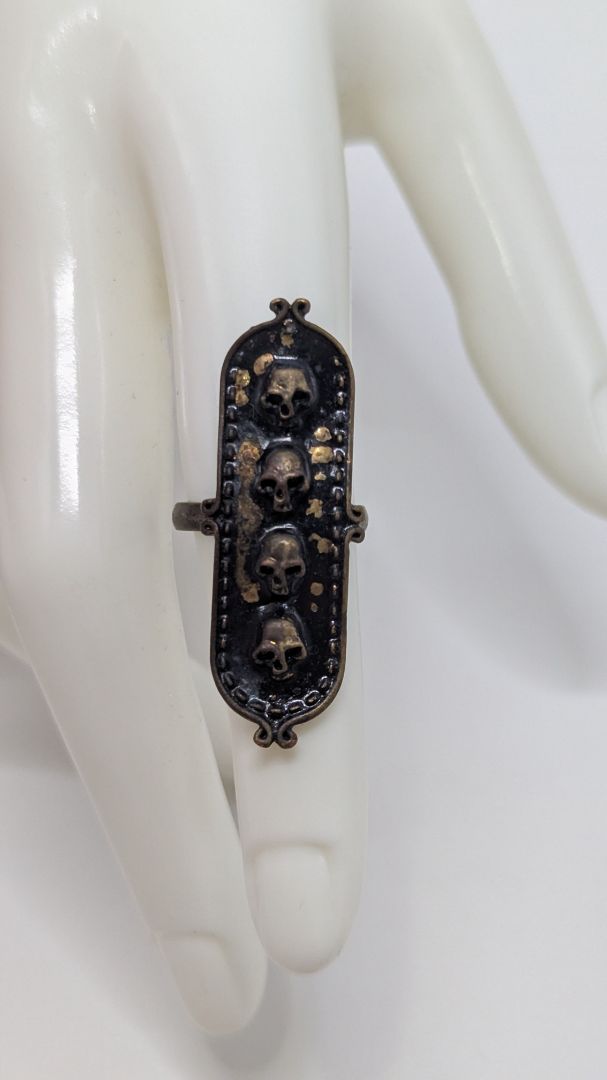 Bronzed Metal Adjustable 4-Skull Emblem Ring
